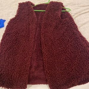 Sherpa like material, plum colored vest. Oversized